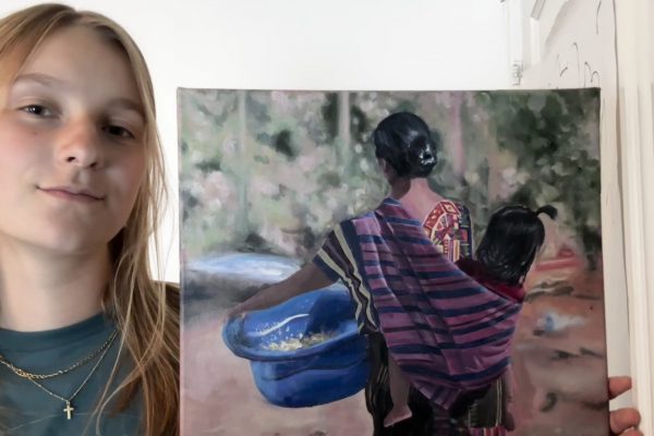Liv and her artwork inspired by her visit to a host family in rural Guatemala in February 2026